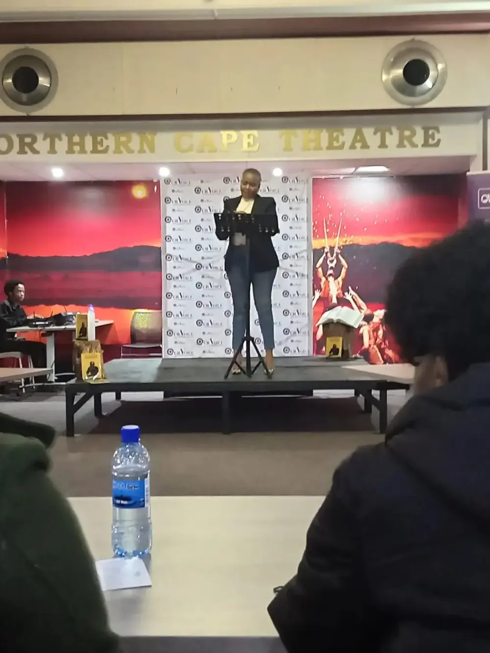 A speaker on stage at the Northern Cape Theatre, Kimberley