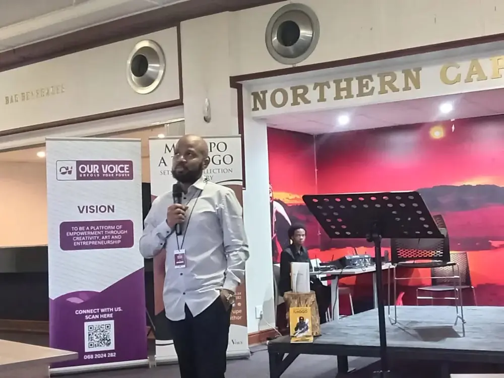 A speaker with a microphone at the Northern Cape Theatre, Kimberley